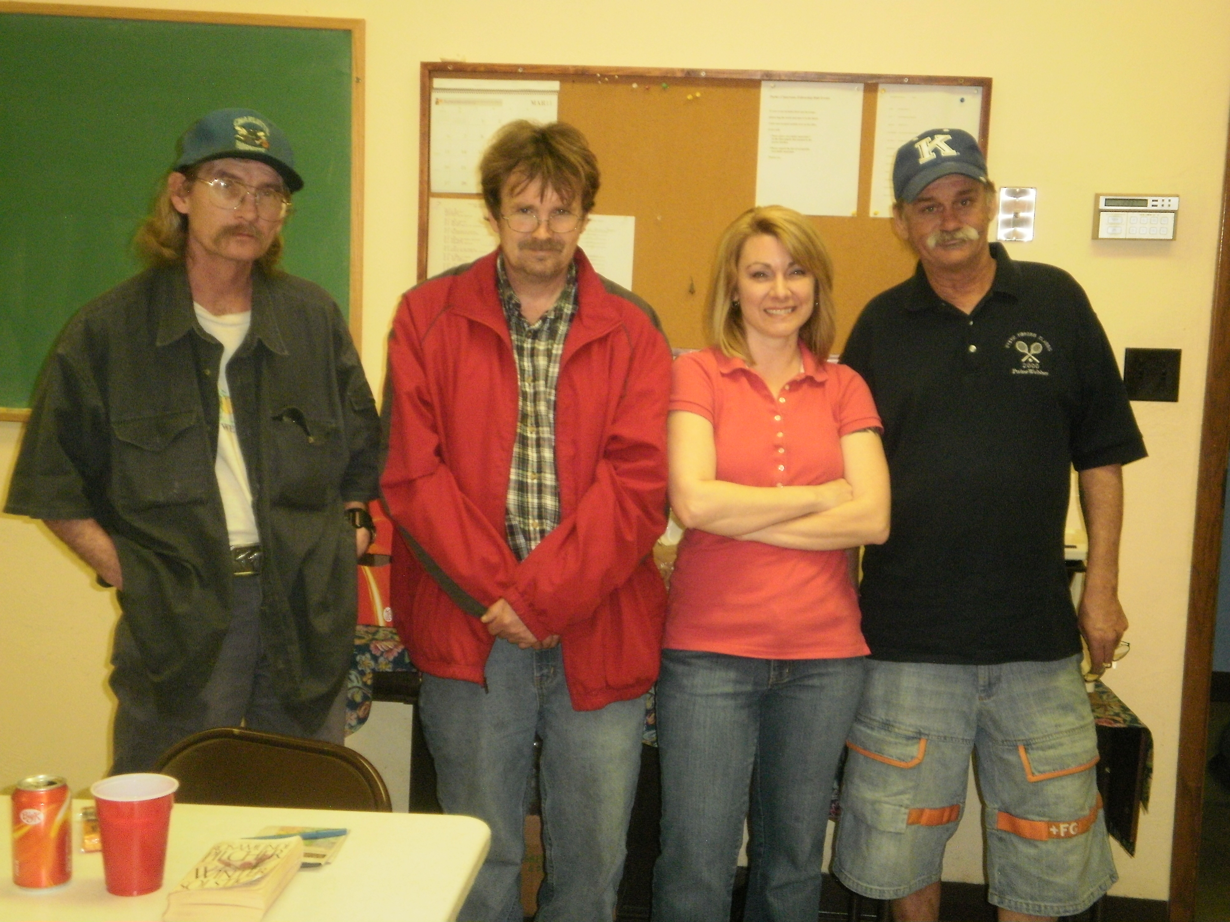 Housing case manager, Karan Vertrees (second from right), leading a weekly small group meeting with program participants (left to right), William Bruner, Bill Acker, and Philip Snyder.