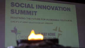 A qulliq (Inuit soapstone lamp) burns at the opening of the Social Innovation Summit